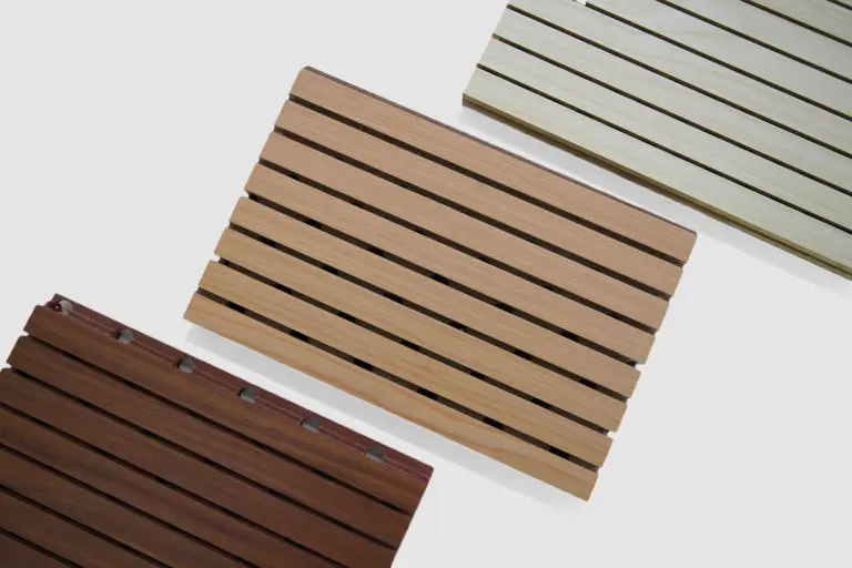 Three rectangular Timberix Grooved Acoustic Panels with evenly spaced horizontal slats, each in a different color—dark brown, light brown, and beige—are displayed on a white background.