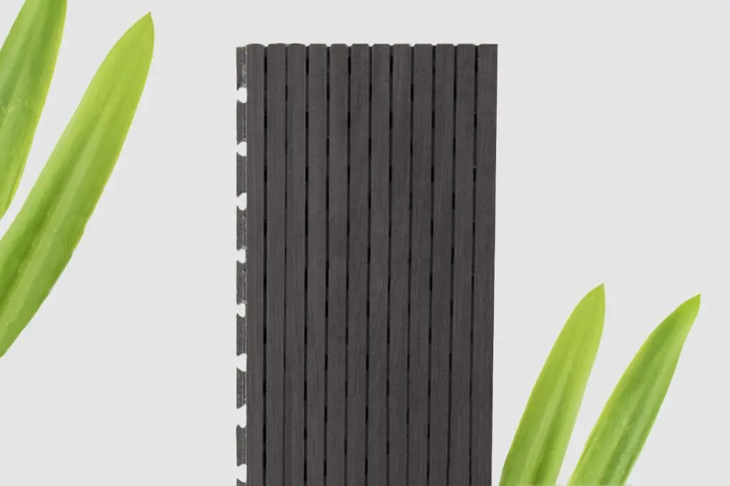 A vertical black Timberix Microgrooved Panel is centered against a light background, with three bright green leaves positioned in the corners.
