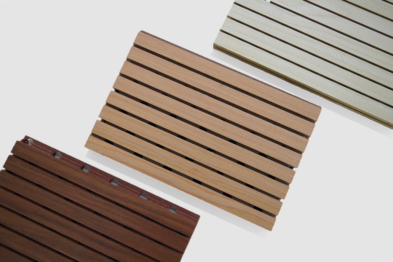 Three rectangular Timberix Grooved Acoustic Panels with evenly spaced horizontal slats, each in a different color—dark brown, light brown, and beige—are displayed on a white background.